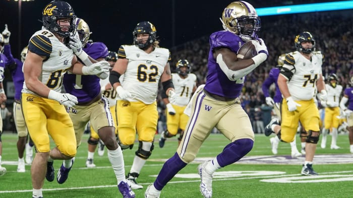 Linebacker Edefuan Ulofoshio heads for the end zone on a 45-yard interception return for a score.
